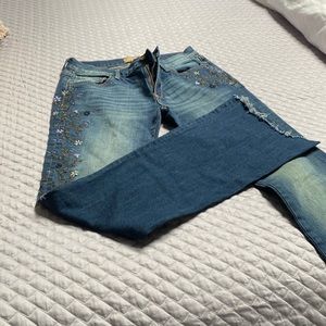 Embroidered driftwood jeans with fringe bottom
